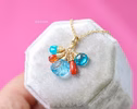 - Solid Gold 14K Carved Blue Topaz and Italian Coral Charm with a Lobster Clasp