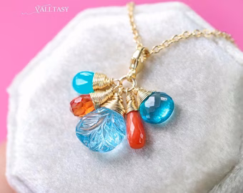 - Solid Gold 14K Carved Blue Topaz and Italian Coral Charm with a Lobster Clasp