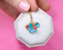 - Solid Gold 14K Carved Blue Topaz and Italian Coral Charm with a Lobster Clasp