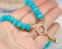 - Solid Gold 14K Silk Knotted Amazonite Necklace with a Shell Charm