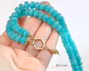 - Solid Gold 14K Silk Knotted Amazonite Necklace with a Shell Charm