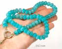 - Solid Gold 14K Silk Knotted Amazonite Necklace with a Shell Charm