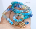 - Solid Gold 14K Silk Knotted Topaz, Larimar, Aquamarine and Opal Necklace