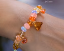 - Solid Gold 14K Spicy Silk Knotted Bracelet with Opals and Peach, Yellow Orange Gemstones