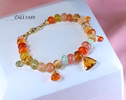 - Solid Gold 14K Spicy Silk Knotted Bracelet with Opals and Peach, Yellow Orange Gemstones