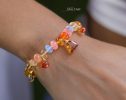 - Solid Gold 14K Spicy Silk Knotted Bracelet with Opals and Peach, Yellow Orange Gemstones