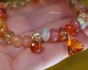 - Solid Gold 14K Spicy Silk Knotted Bracelet with Opals and Peach, Yellow Orange Gemstones