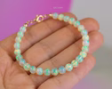 - Dainty Ethiopian Opal Sphere Bracelet in Gold Filled