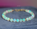 - Large Ethiopian Opal Sphere Bracelet in Gold Filled