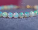 - Dainty Ethiopian Opal Sphere Bracelet in Gold Filled