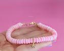 - Solid Gold 14K Angel Skin Pink Coral Bracelet with a Diamond Starfish Charm